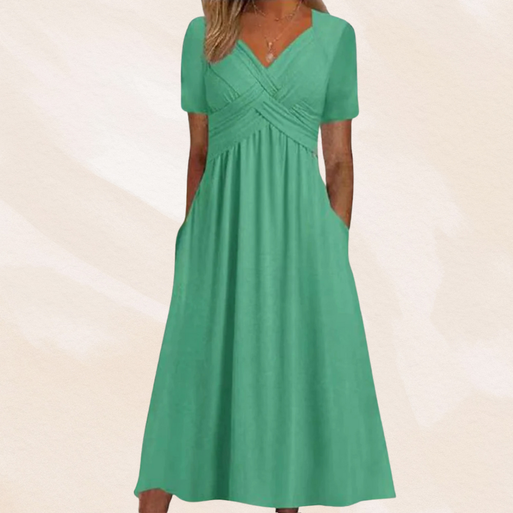 Alina Damen Midikleid in Mintgrün mit V-Ausschnitt, kurzen Ärmeln, Wickel-Oberteil und praktischen Seitentaschen.