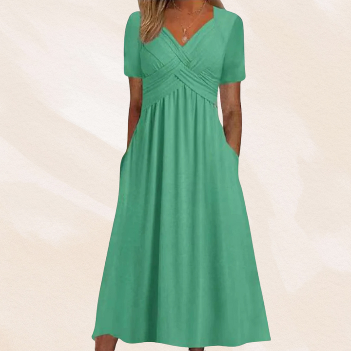 Alina Damen Midikleid in Mintgrün mit V-Ausschnitt, kurzen Ärmeln, Wickel-Oberteil und praktischen Seitentaschen.
