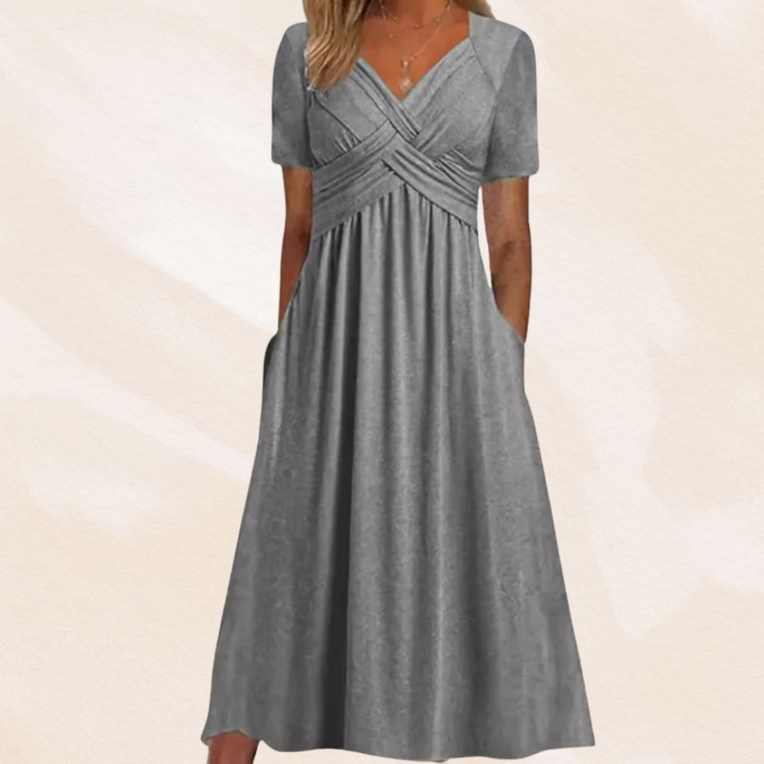 Alina Damen Midikleid in Grau mit V-Ausschnitt, Wickel-Oberteil, kurzen Ärmeln und praktischen Seitentaschen.