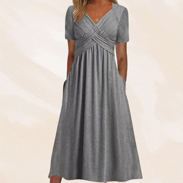 Alina Damen Midikleid in Grau mit V-Ausschnitt, Wickel-Oberteil, kurzen Ärmeln und praktischen Seitentaschen.