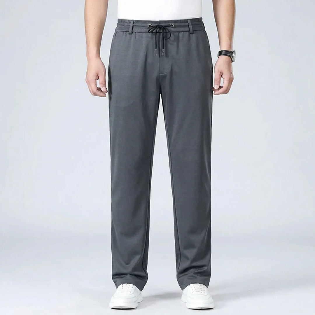 Dunkelgraue Herren-Stoffhose mit geradem Schnitt, elastischem Komfortbund und praktischem Kordelzug für einen modernen Look.