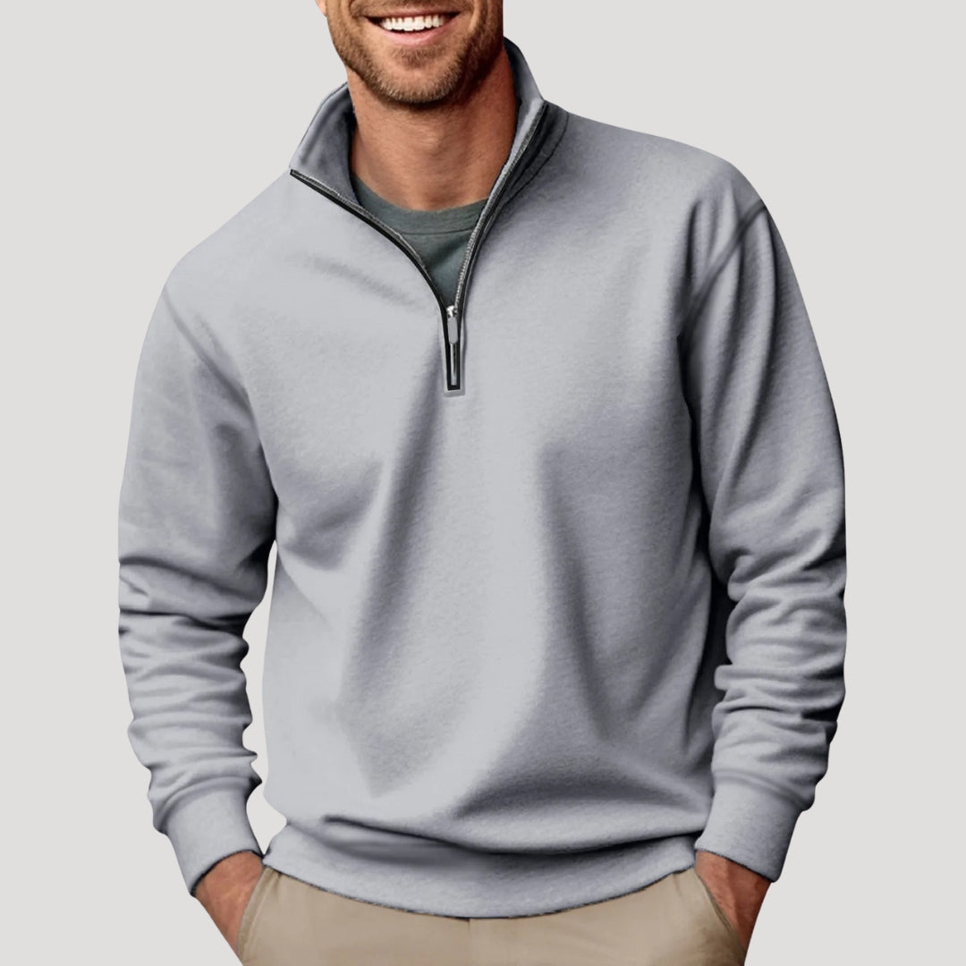 Graues Herren-Sweatshirt mit Stehkragen, kurzem Reißverschluss und gerippten Bündchen in lockerer Passform.