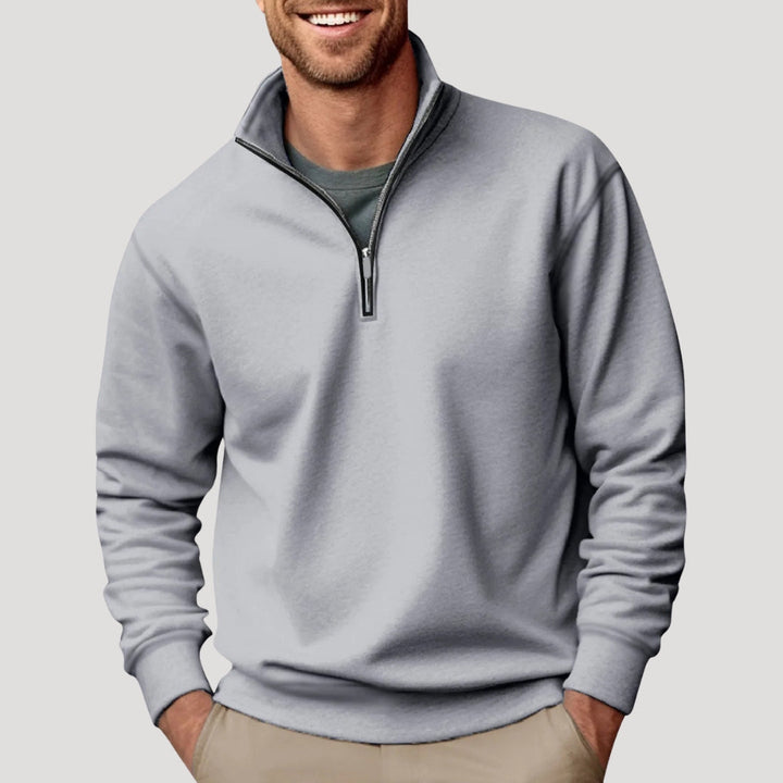 Graues Herren-Sweatshirt mit Stehkragen, kurzem Reißverschluss und gerippten Bündchen in lockerer Passform.