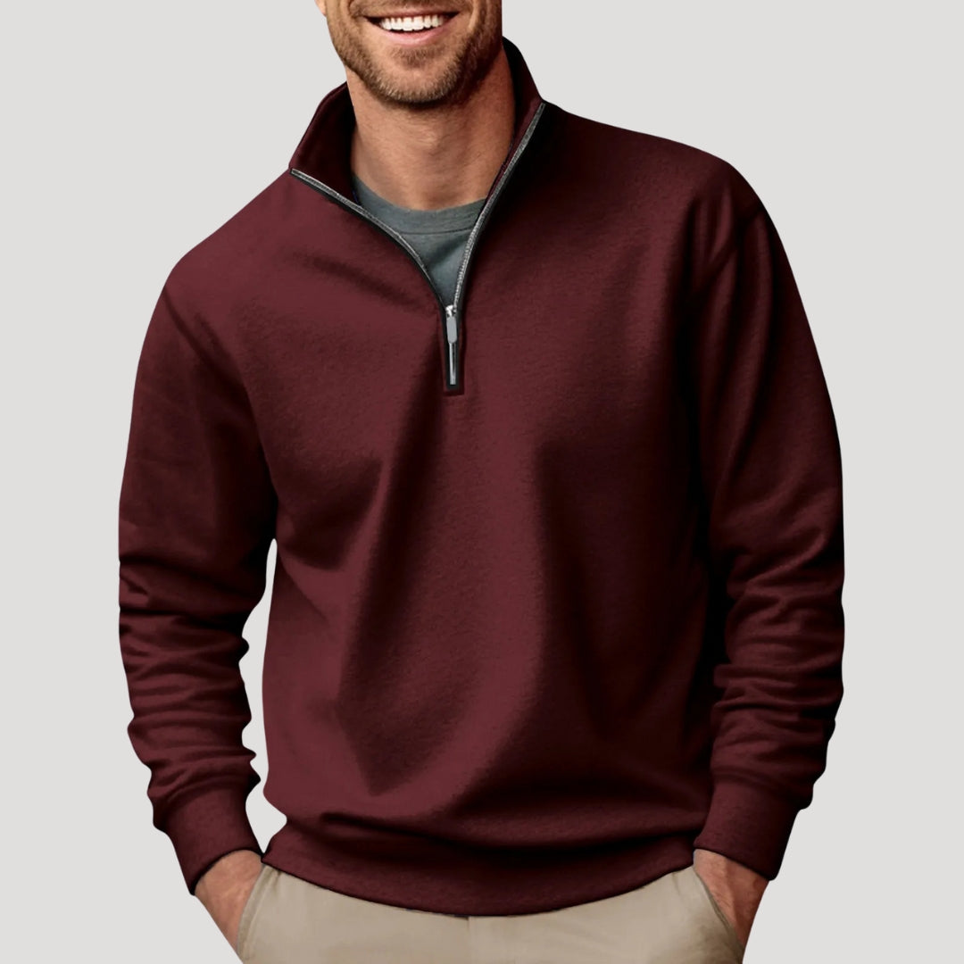 Dunkelrotes Herren-Sweatshirt mit Stehkragen, kurzem Reißverschluss und gerippten Bündchen in lockerer Passform.