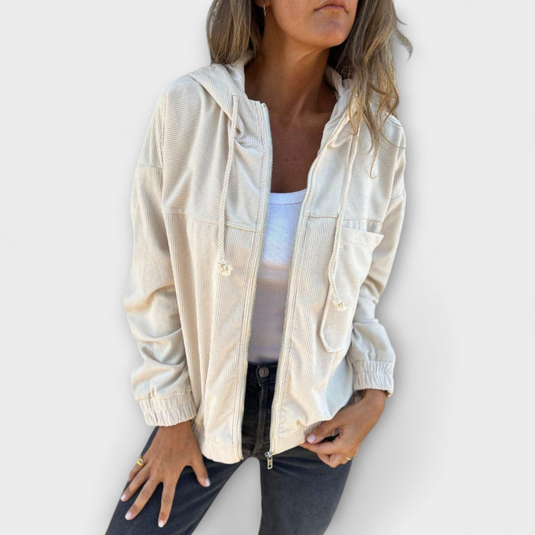 Beige Cord-Kapuzenjacke für Damen mit Reißverschluss, Kordelzug und entspannter Passform für einen lässigen Retro-Look.