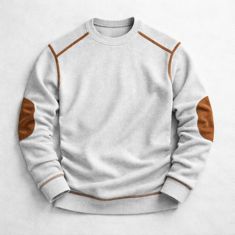 Grauer Herren-Strickpullover mit Waffelstruktur, Rundhalsausschnitt und braunen Ellbogen-Patches.