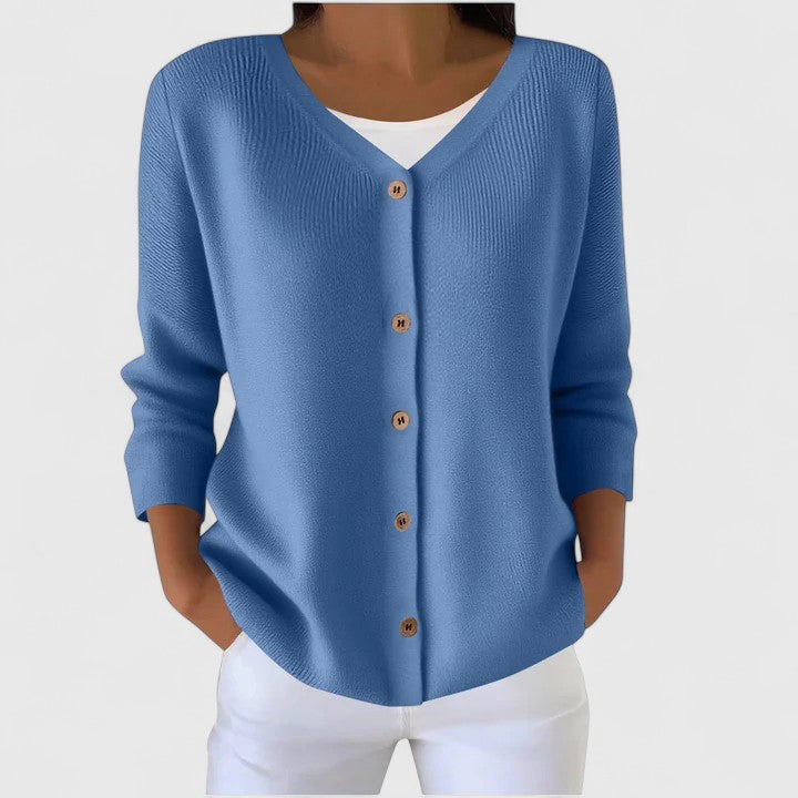 Blaue Strickjacke mit V-Ausschnitt, Knopfleiste und gerippten Details in entspannter Passform.