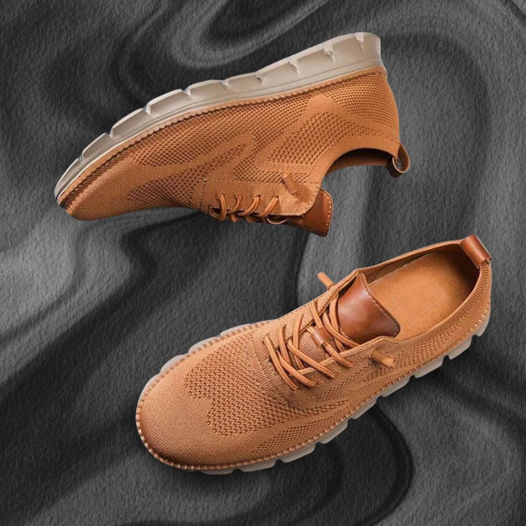 Brauner Herren-Sneaker Fabian aus atmungsaktivem Mesh mit Lederoptik-Details und flexibler, gerillter Laufsohle.