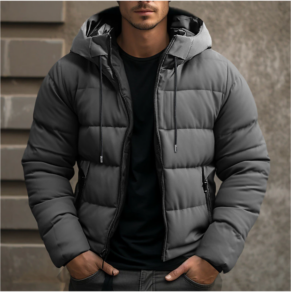Graue Herren-Steppjacke mit Kapuze, Kordelzug und Reißverschluss für kalte Wintertage.
