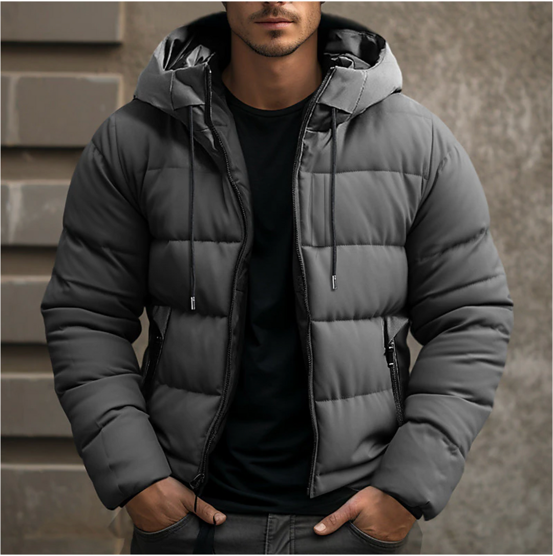 Graue Herren-Steppjacke mit Kapuze, Kordelzug und Reißverschluss für kalte Wintertage.