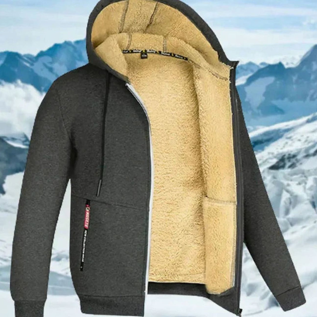 Dunkelgraue Fabio Kapuzenjacke mit kuscheligem beigem Fleecefutter, Reißverschluss und praktischen Taschen für den Winter.