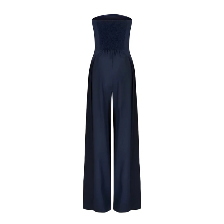 Trägerloser Larissa Jumpsuit in Dunkelblau mit weitem Bein und gerafftem Rückenteil.