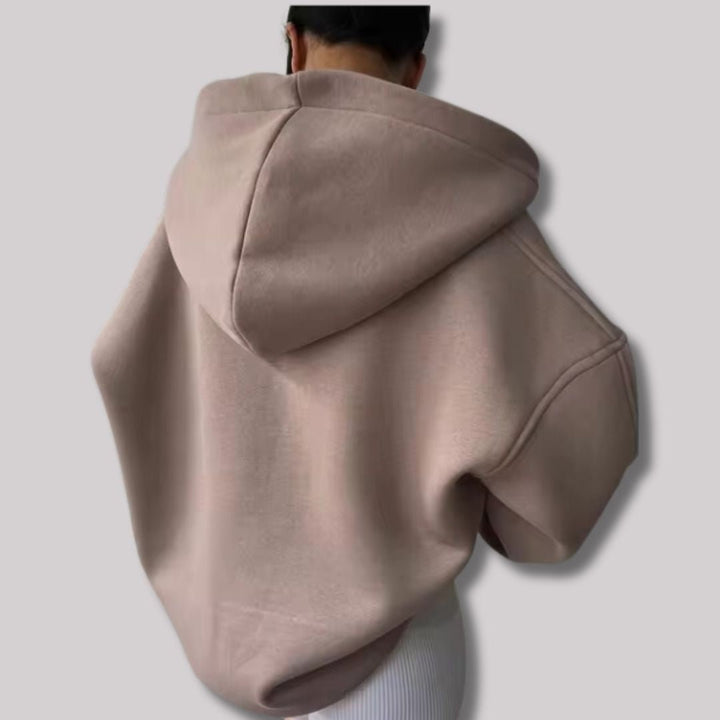 Beiger Oversized-Hoodie mit Kapuze und weitem Drop-Shoulder-Schnitt in lässiger Passform.