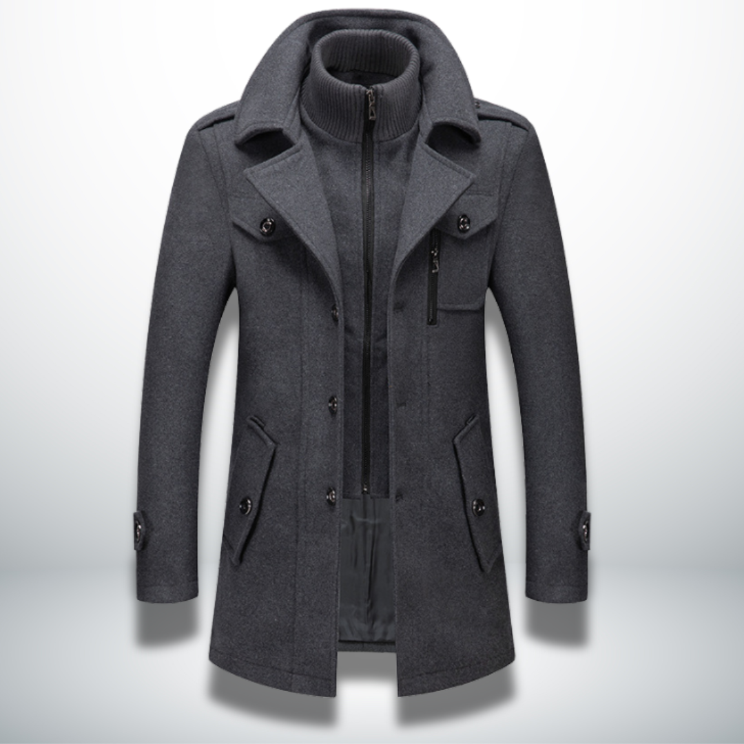 Dunkelgrauer Herren-Wollmantel mit Doppelkragen, Reißverschluss, Knopfleiste und Brusttasche im smarten Casual-Stil.