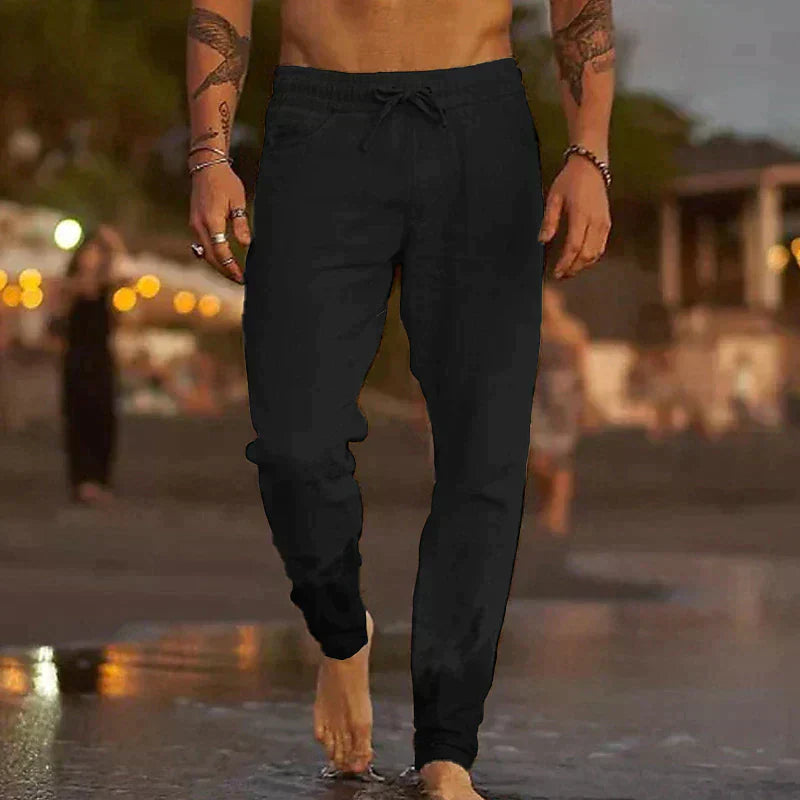 Schwarze Herren-Leinenhose mit elastischem Kordelzugbund und lockerem Schnitt für einen entspannten Sommer-Look.