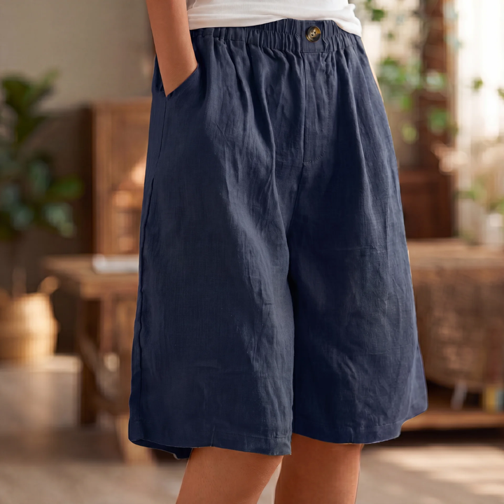 Dunkelblaue Lisa Damen Leinen-Sommerhose mit elastischem Bund, lockerem Schnitt und praktischen Taschen.
