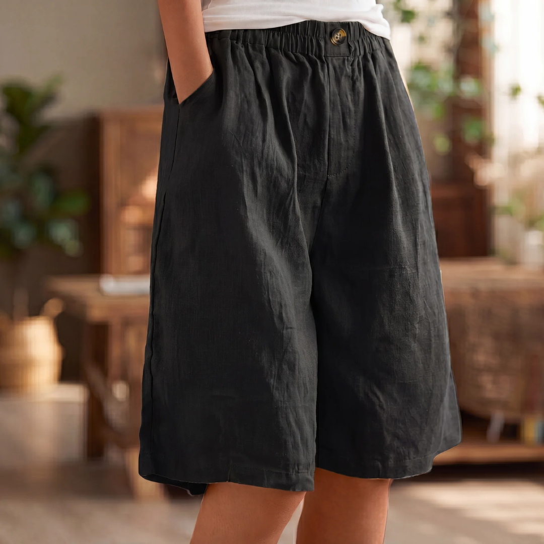 Damen Lisa kurze Leinen-Sommerhose in Schwarz mit elastischem Bund und Taschen.