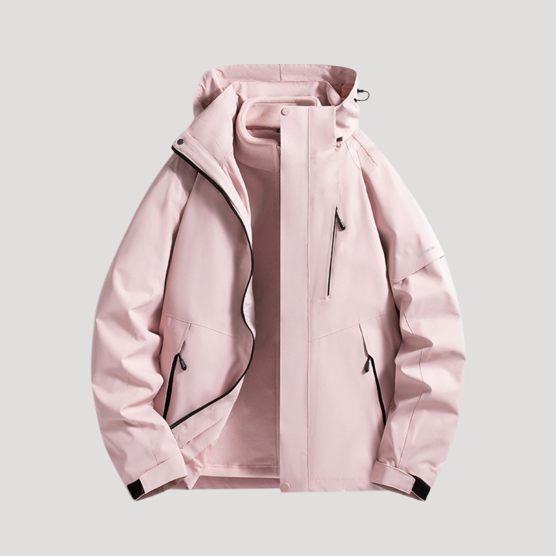 Hellrosa wasserdichte Damen-Outdoorjacke mit Kapuze, Reißverschlusstaschen und sportlichem Design.