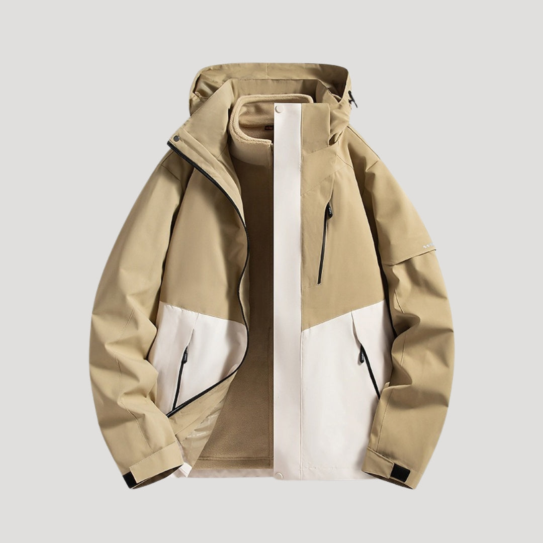 Beigefarbene Marei Outdoorjacke mit Kapuze, Reißverschlusstaschen und zweifarbigem Design für Damen.