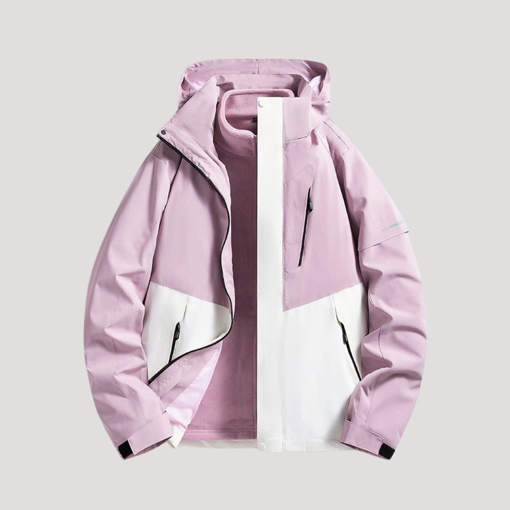 Hellrosa und weiße Damen Outdoorjacke mit Kapuze, Reißverschlusstaschen und wasserabweisendem Material.