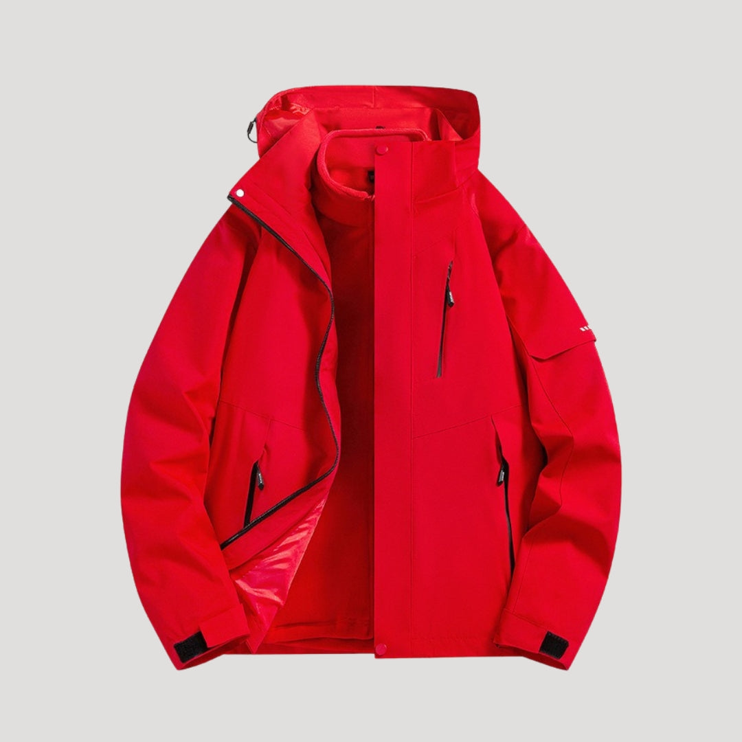 Rote, wasserdichte Damen-Outdoorjacke mit Kapuze, Reißverschlusstaschen und verstellbaren Ärmelbündchen.