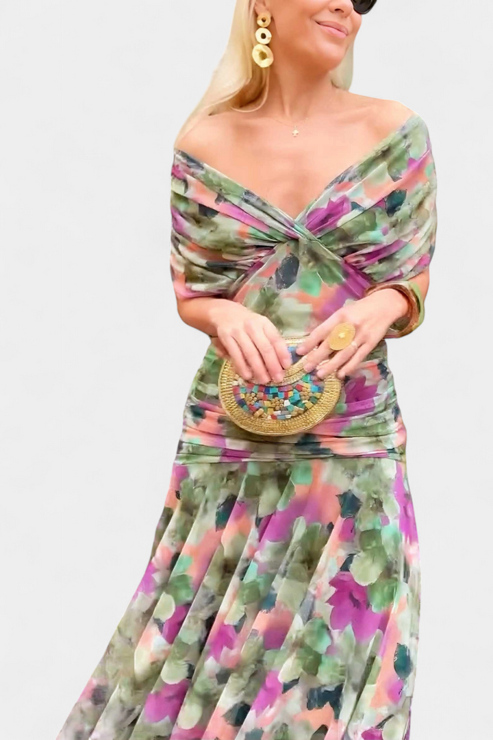 Elegantes Melina Maxikleid mit buntem Blumenmuster, V-Ausschnitt, geraffter Taille und fließendem Rock.