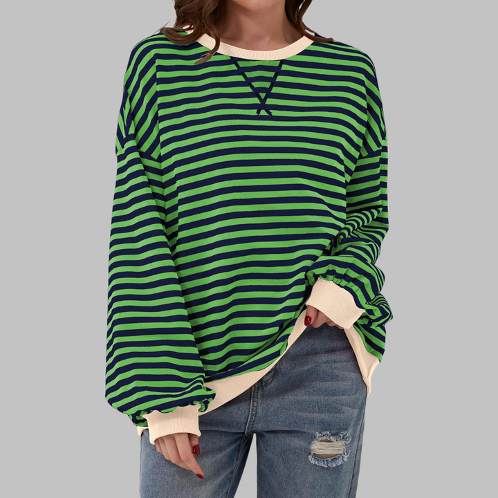 Oversized Damen-Sweatshirt mit grün-blauem Streifenmuster, Rundhalsausschnitt und beigen Bündchen in lässiger Passform.