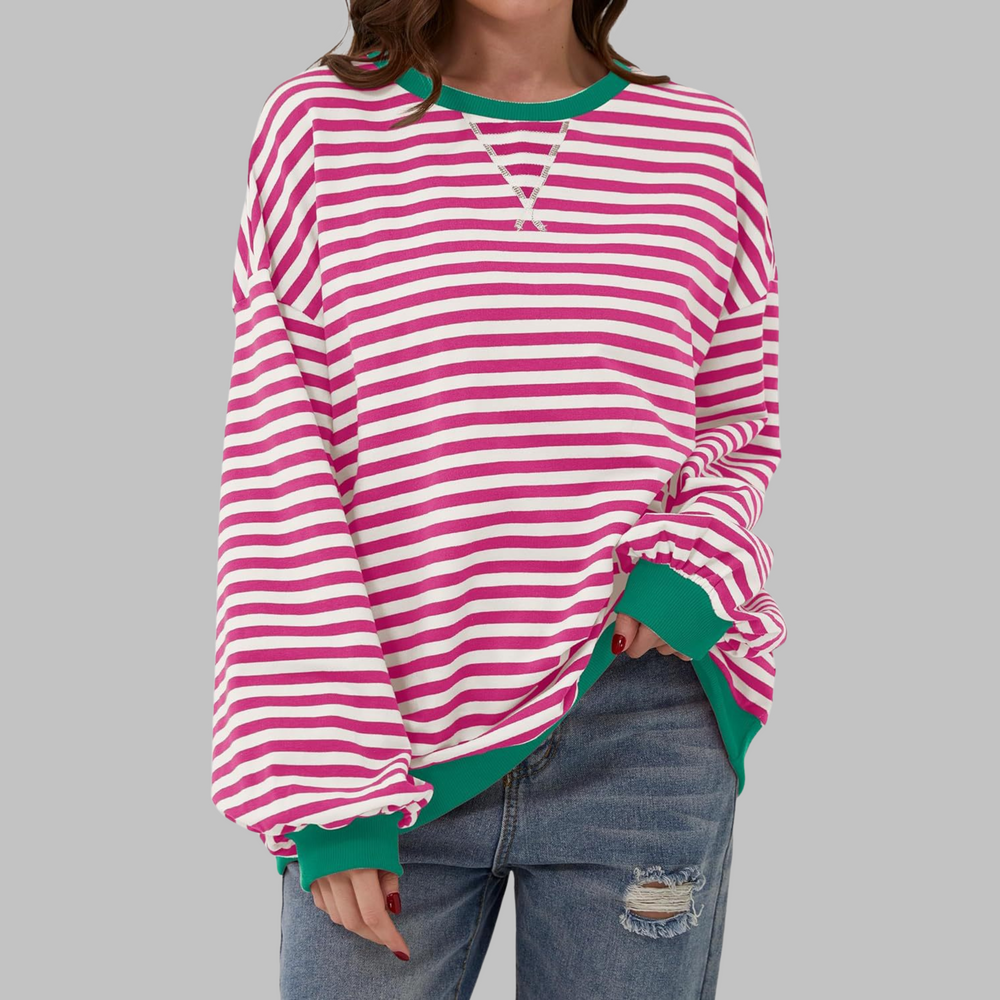 Oversized Damen-Sweatshirt mit pink-weißem Streifenmuster, grünem Rundhalsausschnitt und Bündchen in lässiger Passform.