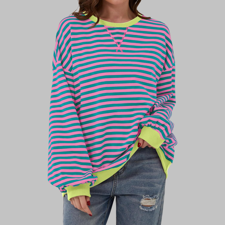 Oversized Damen-Sweatshirt mit pink-türkisem Streifenmuster, Rundhalsausschnitt und neongelben Bündchen.