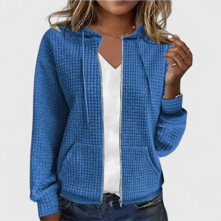 Blaue Damen-Steppjacke mit Waffel-Struktur, Kapuze, Kordelzug und durchgehendem Reißverschluss.