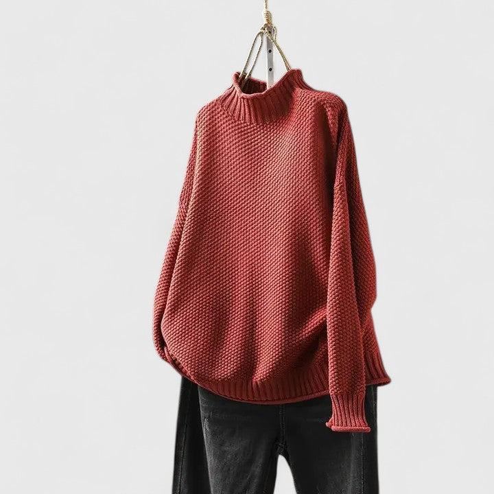 Roter Damen-Strickpullover mit Stehkragen, strukturiertem Muster und überschnittenen Schultern in entspannter Passform.