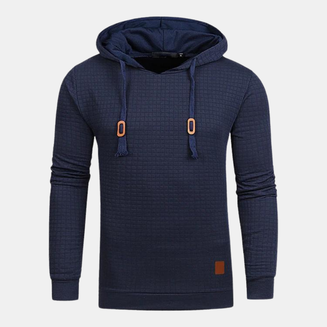 Dunkelblauer Herren-Kapuzenpullover mit strukturiertem Karomuster, Kapuze mit Kordelzug und braunen Leder-Details.