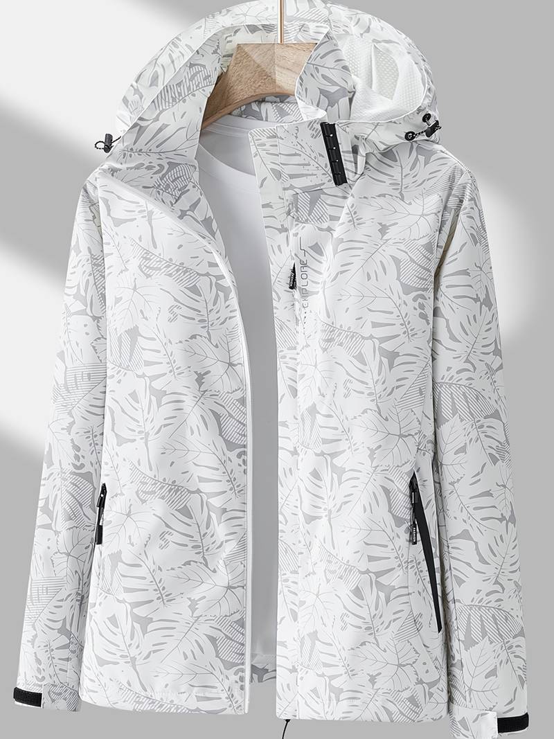 Wasserdichte Damenjacke in Weiß mit grauem Blätter-Print, Kapuze und Reißverschlusstaschen.