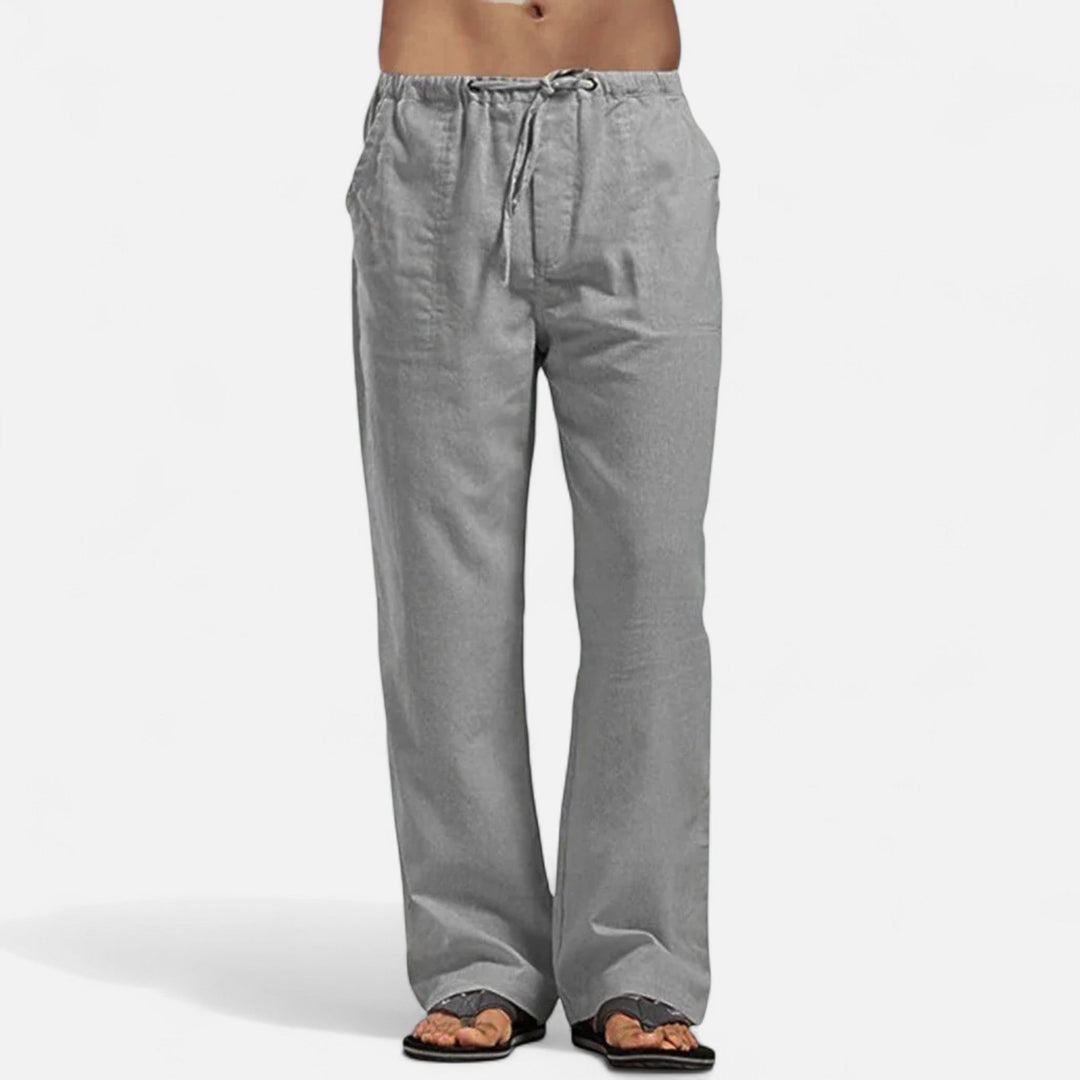 Graue, weit geschnittene Herren-Relaxhose aus leichtem Material mit elastischem Bund und Kordelzug für maximalen Komfort.