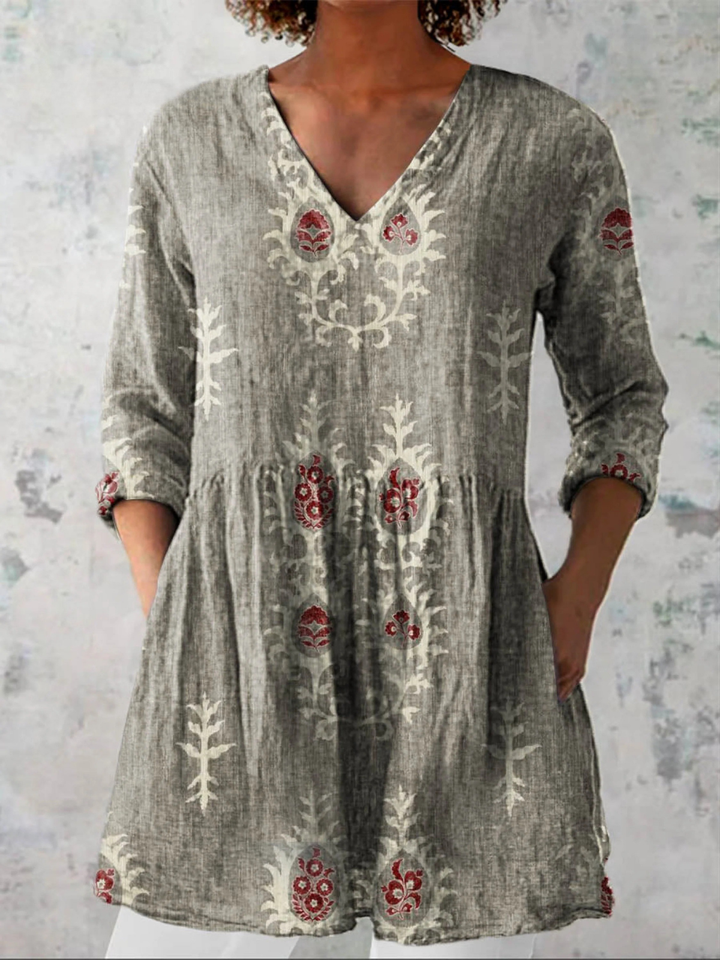 Graue Tunika mit V-Ausschnitt, Boho-Blumenmuster, geraffter Taille und Taschen in lockerer Passform.