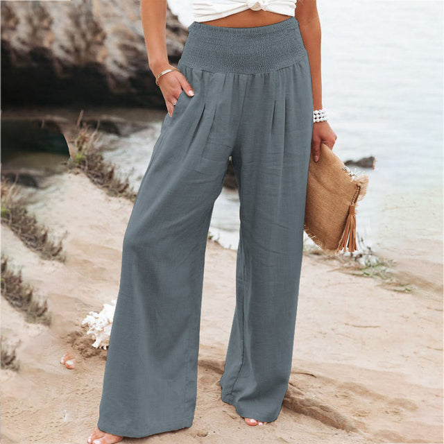 Damen Sara Leinen Sommerhose in Grau mit weitem Bein, elastischem Bund und seitlichen Taschen.