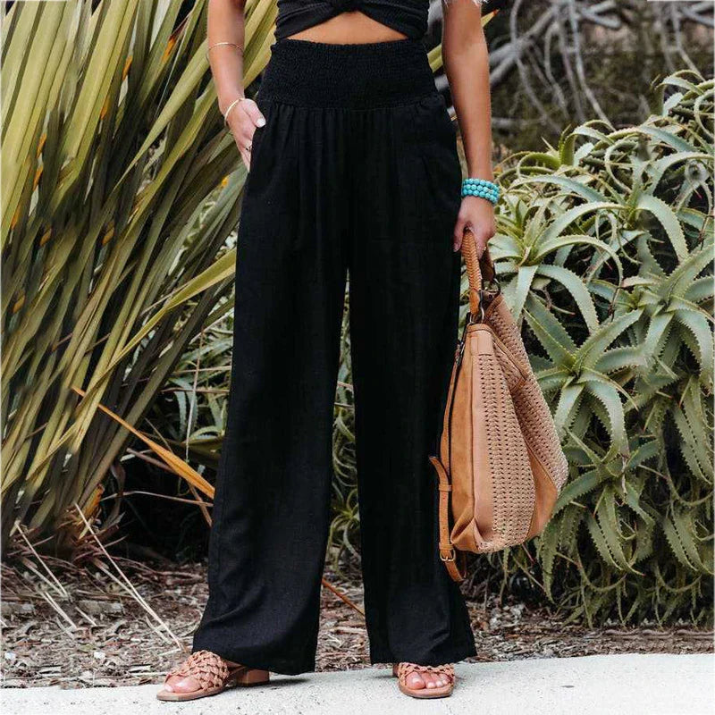Damen Sara Leinen Sommerhose in Schwarz mit weitem Bein, elastischem Bund und praktischen Taschen.
