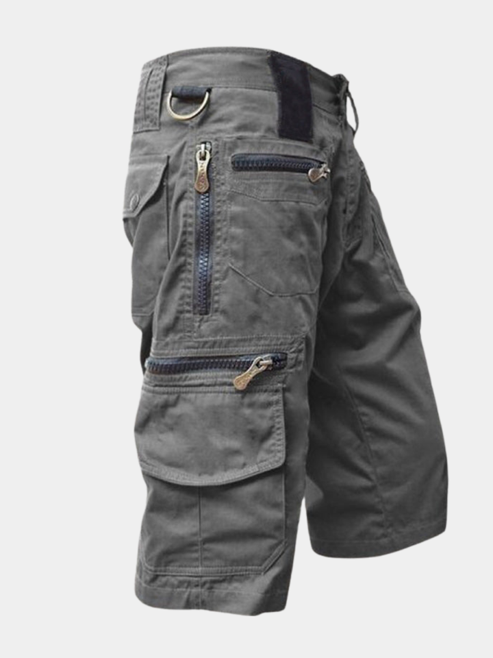 Graue Silvan Cargo-Shorts aus Baumwolle mit mehreren Reißverschlusstaschen und praktischem D-Ring.