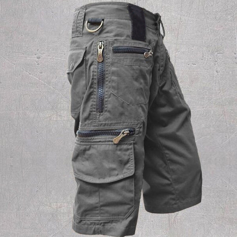 Dunkelgraue Silvan Cargo Shorts aus Baumwolle mit Reißverschlusstaschen, D-Ring und elastischem Bund für Outdoor-Aktivitäten.