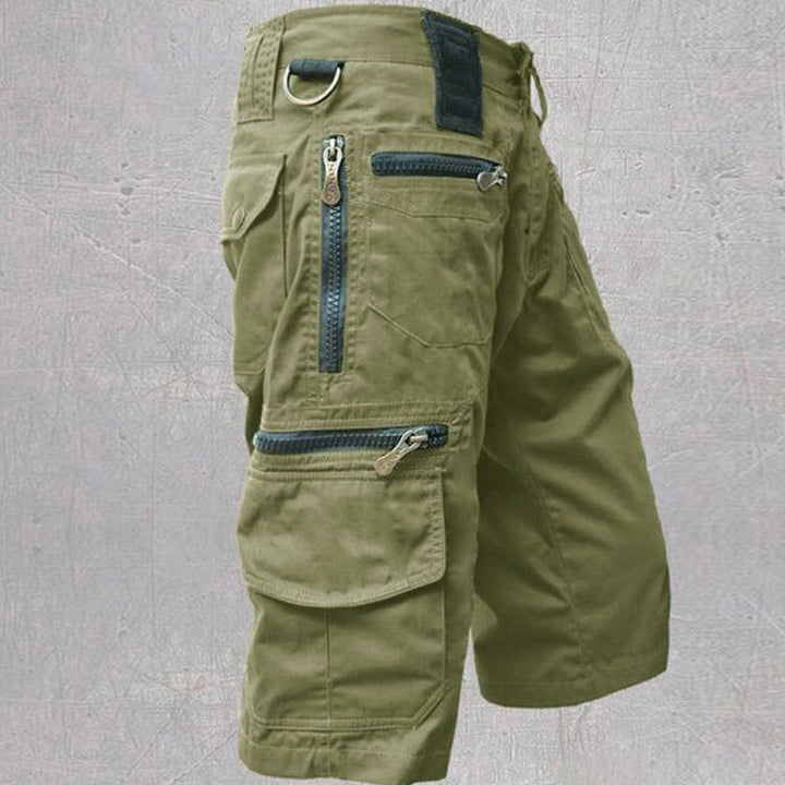 Olivgrüne Herren-Cargoshorts aus Baumwolle mit Reißverschlusstaschen, D-Ring und elastischem Bund für Outdoor-Aktivitäten.