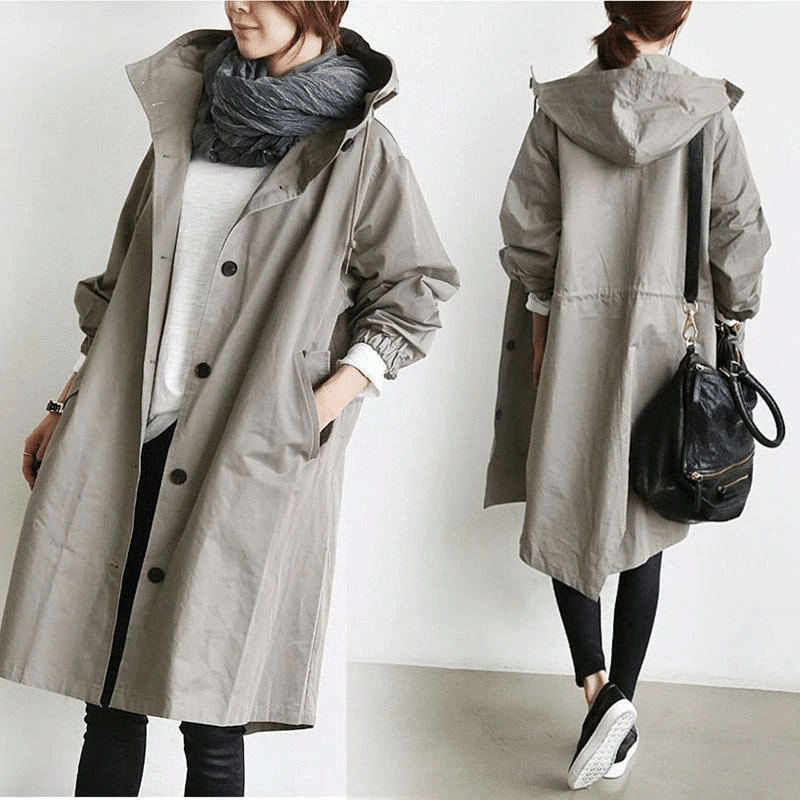 Graue, lange Damen-Windjacke im Oversized-Schnitt mit Kapuze, Knopfleiste und elastischen Ärmelbündchen.