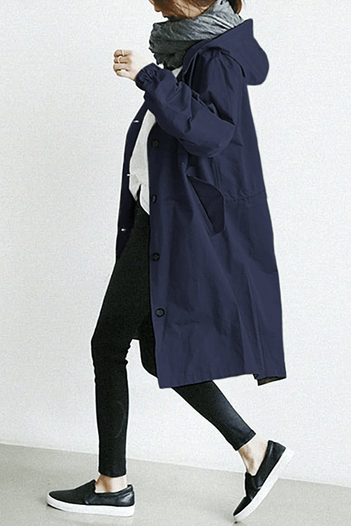 Dunkelblaue, lange Damen-Windjacke im Oversized-Schnitt mit Kapuze, Knopfleiste und elastischen Ärmelbündchen.
