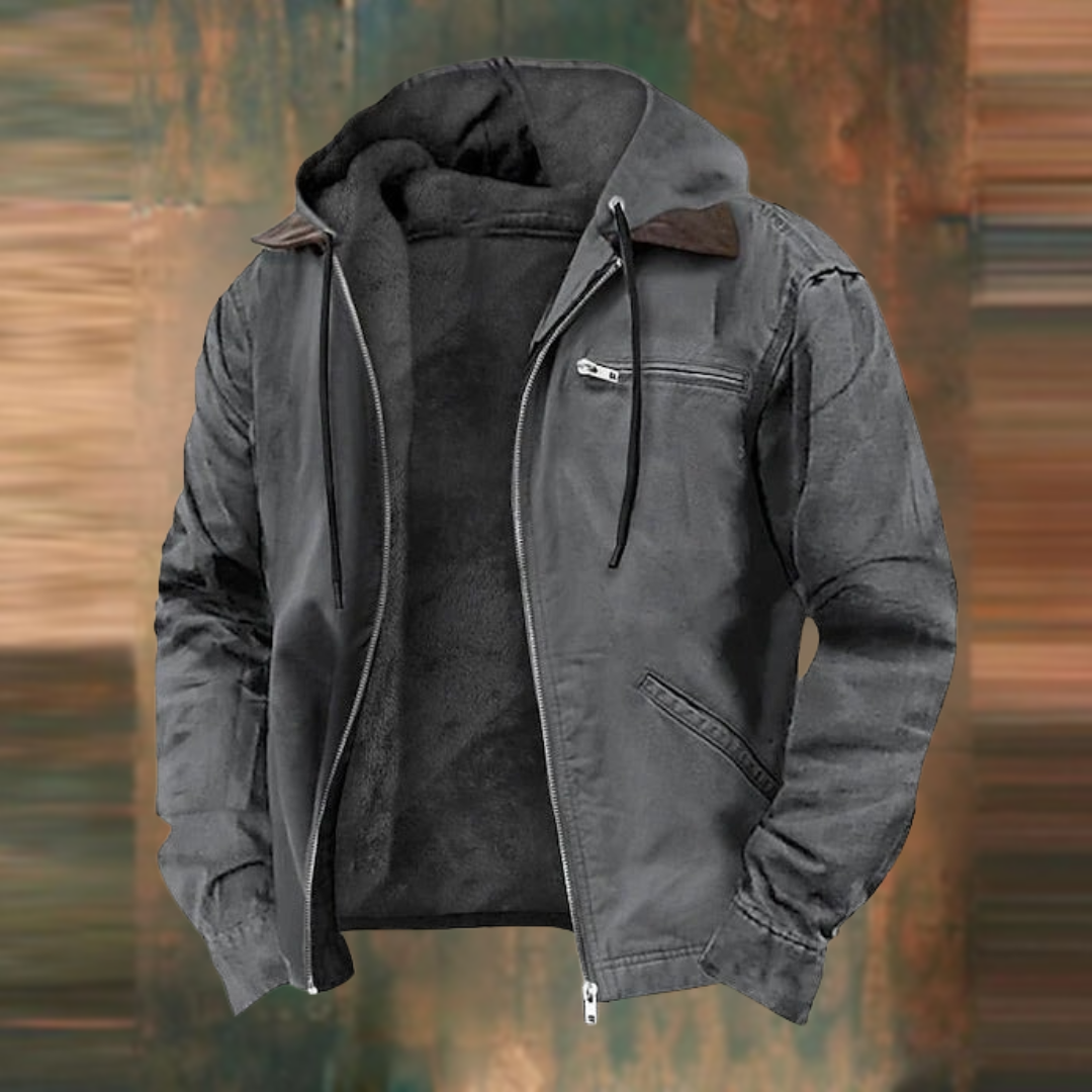 Dunkelgraue Herren-Winterjacke mit flauschigem Innenfutter, Kapuze, Kordelzug und praktischen Reißverschlusstaschen.
