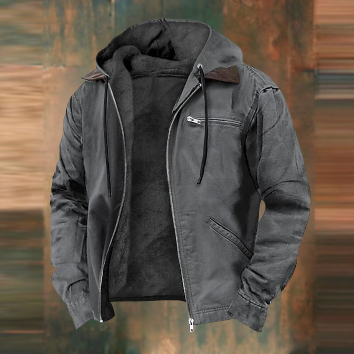 Dunkelgraue Herren-Winterjacke mit flauschigem Innenfutter, Kapuze, Kordelzug und praktischen Reißverschlusstaschen.