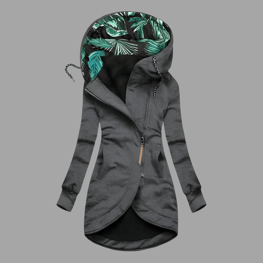 Dunkelgraue Damen-Kapuzenjacke mit asymmetrischem Reißverschluss und grünem Blattmuster-Innenfutter an der Kapuze.